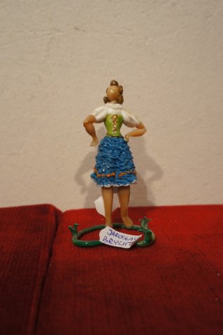 žena