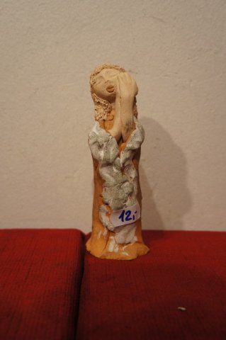 žena