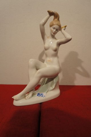 žena