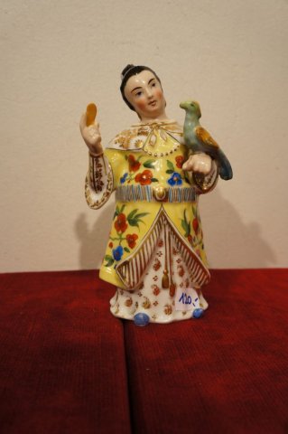 žena