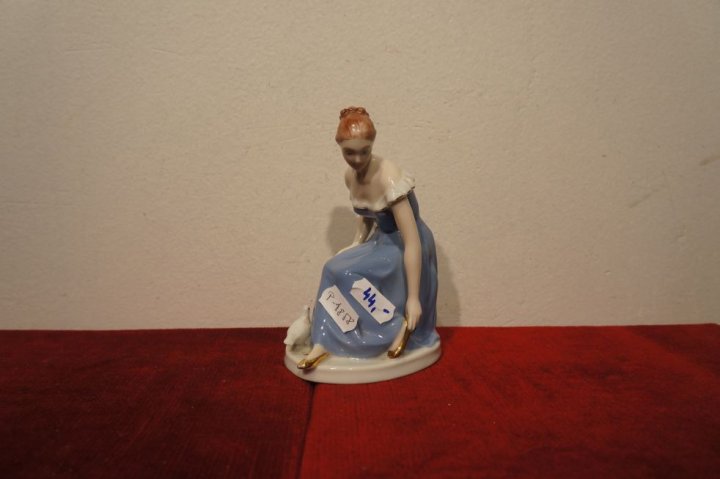 žena